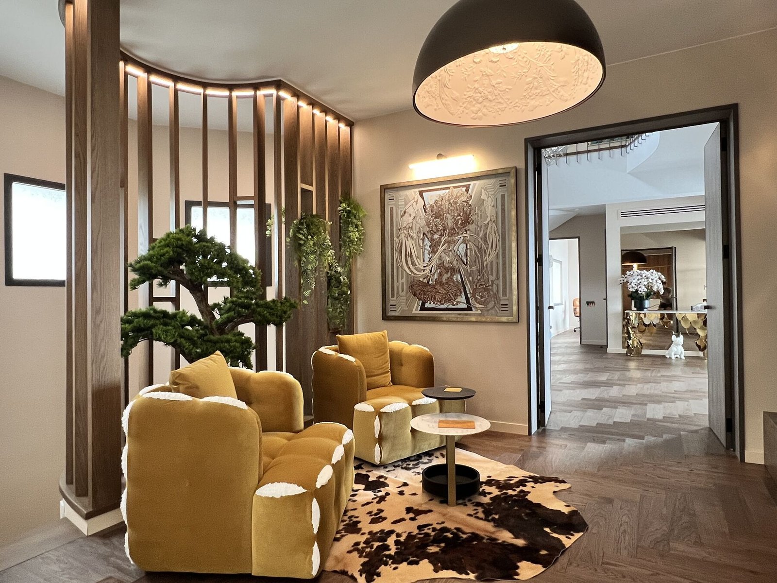 Open living area with marble floors and grey sofa