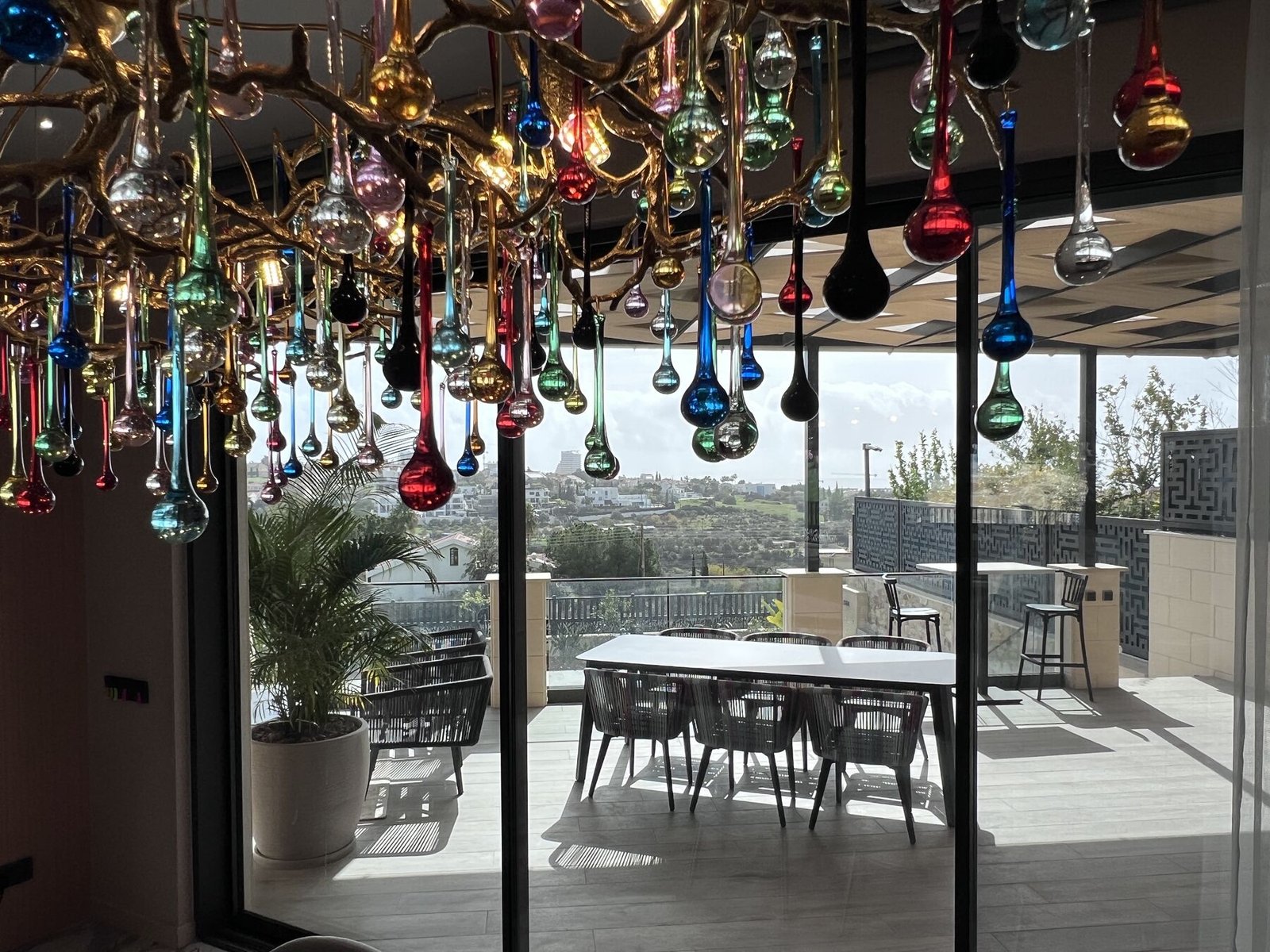Kitchen with rainbow glass chandelier