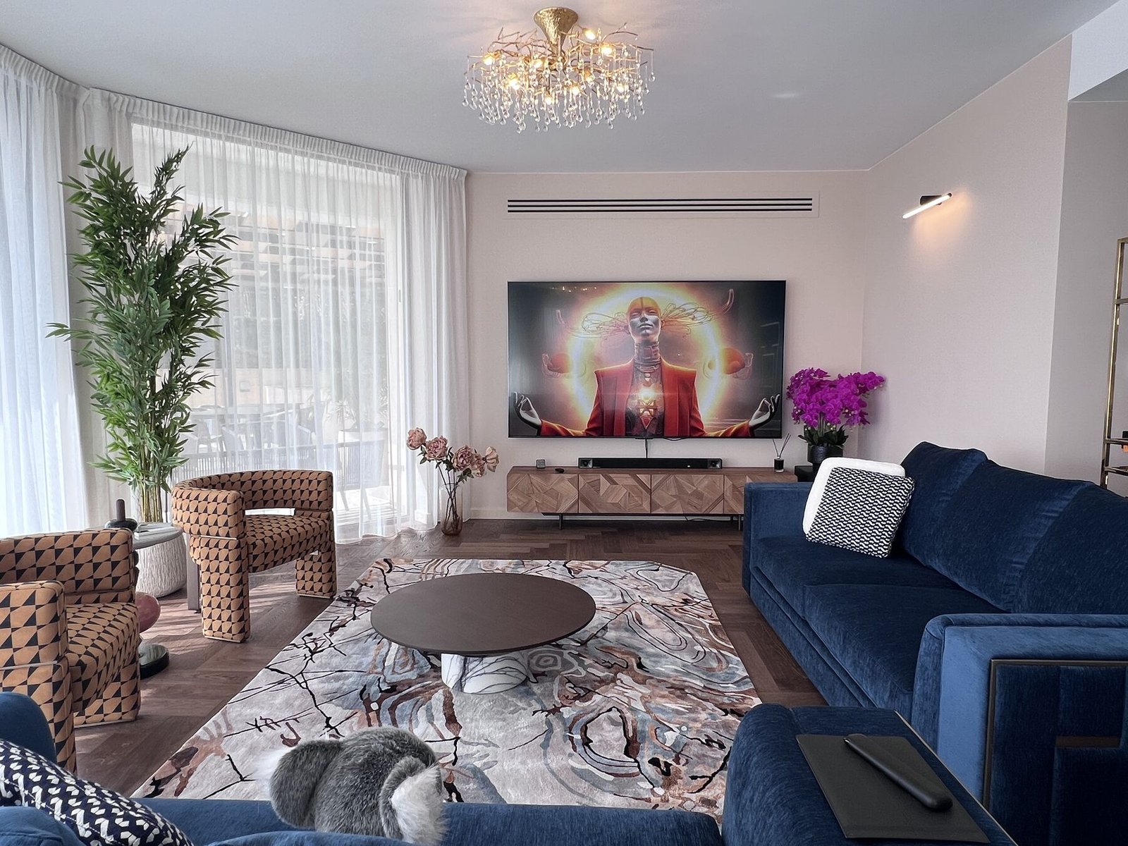 Open living area with deep blue sofas